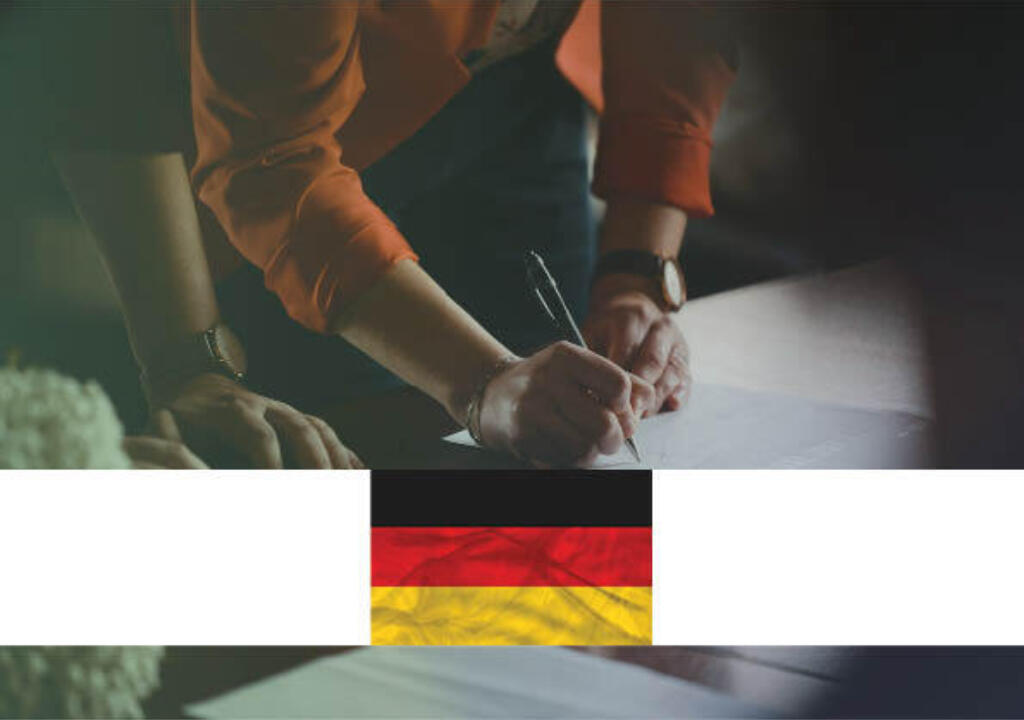 A woman is writing something on a piece of paper that is lying down on a table. There is another person next to her. The setting is professional. A white banner with the flag of Germany shows that this policy monitor item is about a development in Germany.


Een vrouw schrijft iets op een stuk papier dat op een tafel ligt. Er staat nog iemand naast haar. De setting is professioneel. Een witte banner met de vlag van Duitsland laat zien dat dit beleidsmonitor item over een ontwikkeling in Duitsland gaat.