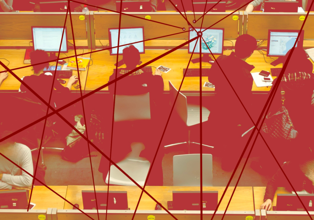 A computer lab with three rows of four desks, each occupied by students working at computers. Overlaying the computer lab are red lines connecting through nodes, symbolizing the flow of communication, data exchange, and interconnected networks.