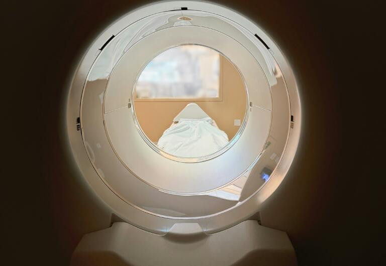 Image of a CT Scan device. These days, CT scanners may use AI-based image reconstruction