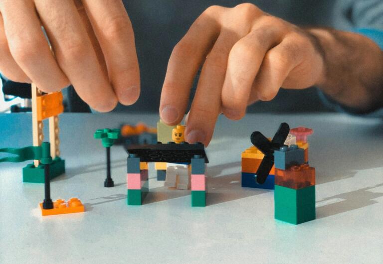A man telling story with Lego