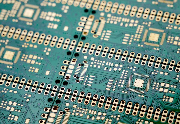Close up of a circuit board. A set of unassembled PCBs with ENIG (Gold Finish). The PCBs are for Mitayi Pico RP1 development board based on Raspberry Pi RP2040 microcontroller. It was designed in KiCad by CIRCUITSTATE Electronics.